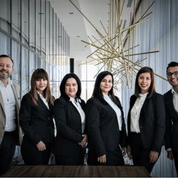 Team of coworkers standing together in an office