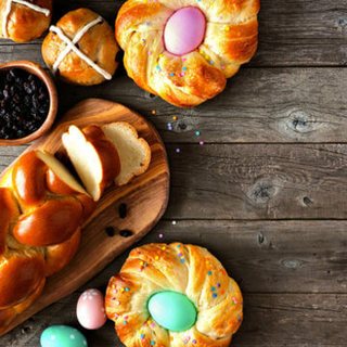 Braided Easter bread rings baked around colored eggs